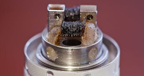 burnt vape coil with gunk built up