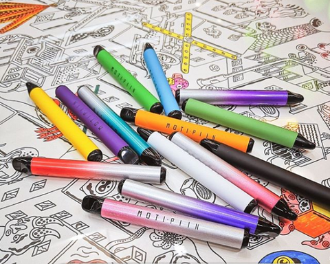 A pile of colorful vape pens scattered across a black and white drawing.