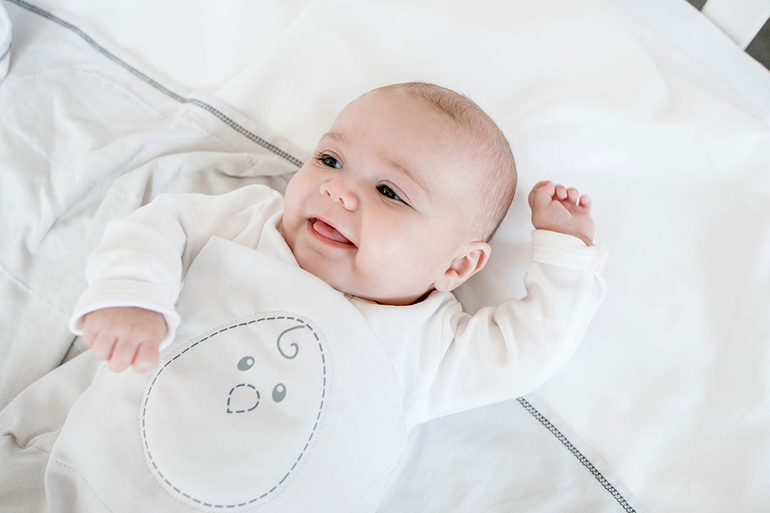 baby getting into zen swaddle