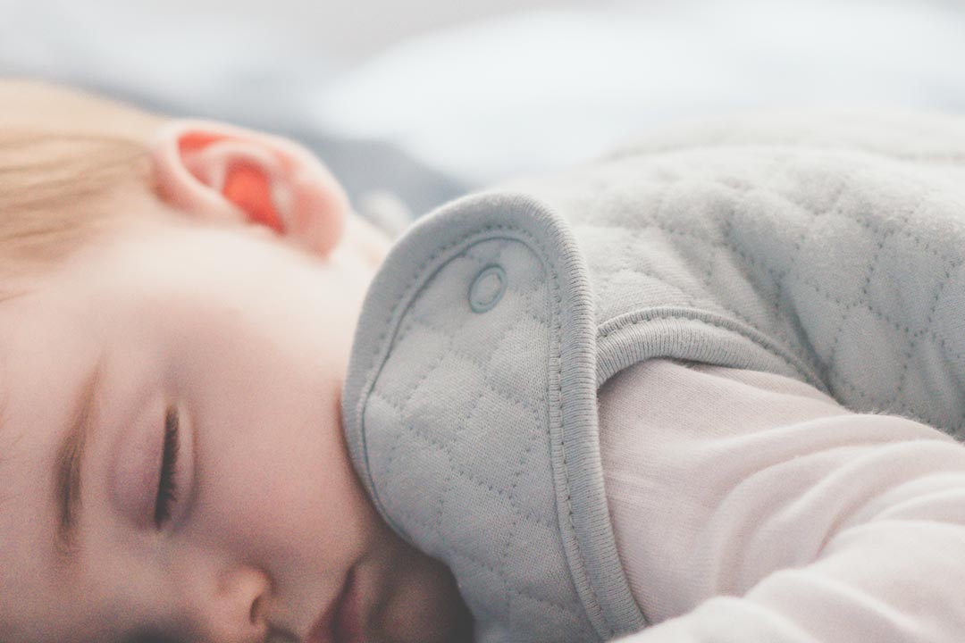 how to help baby roll over - tummy sleeper