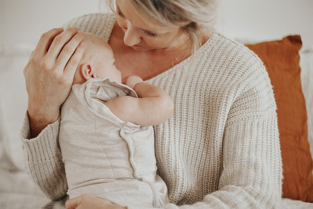 mom holding baby