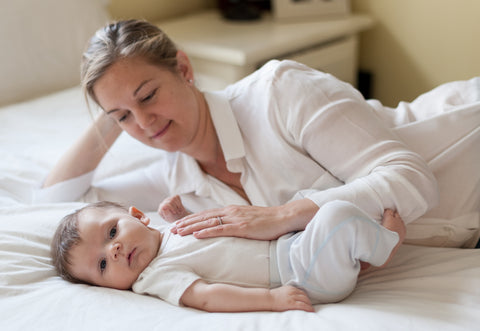 mother soothing baby into a nap