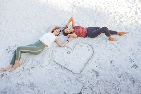 Women on a beach with Rose Buddha Wear