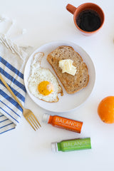 Toast with egg and Balance the Superfood Shot Foundation and Turmeric Blend
