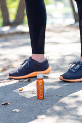 Running shoes with Balance the Superfood Shot Turmeric Blend