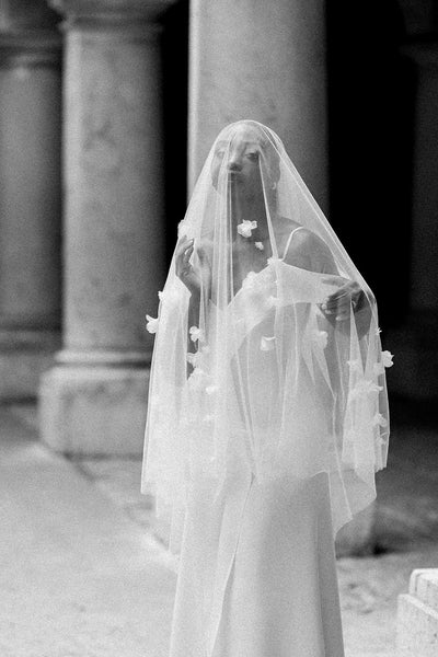 A bride wearing a floral wedding veil