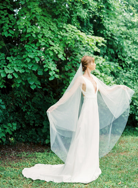 A bride wearing a waltz length two tier wedding veil