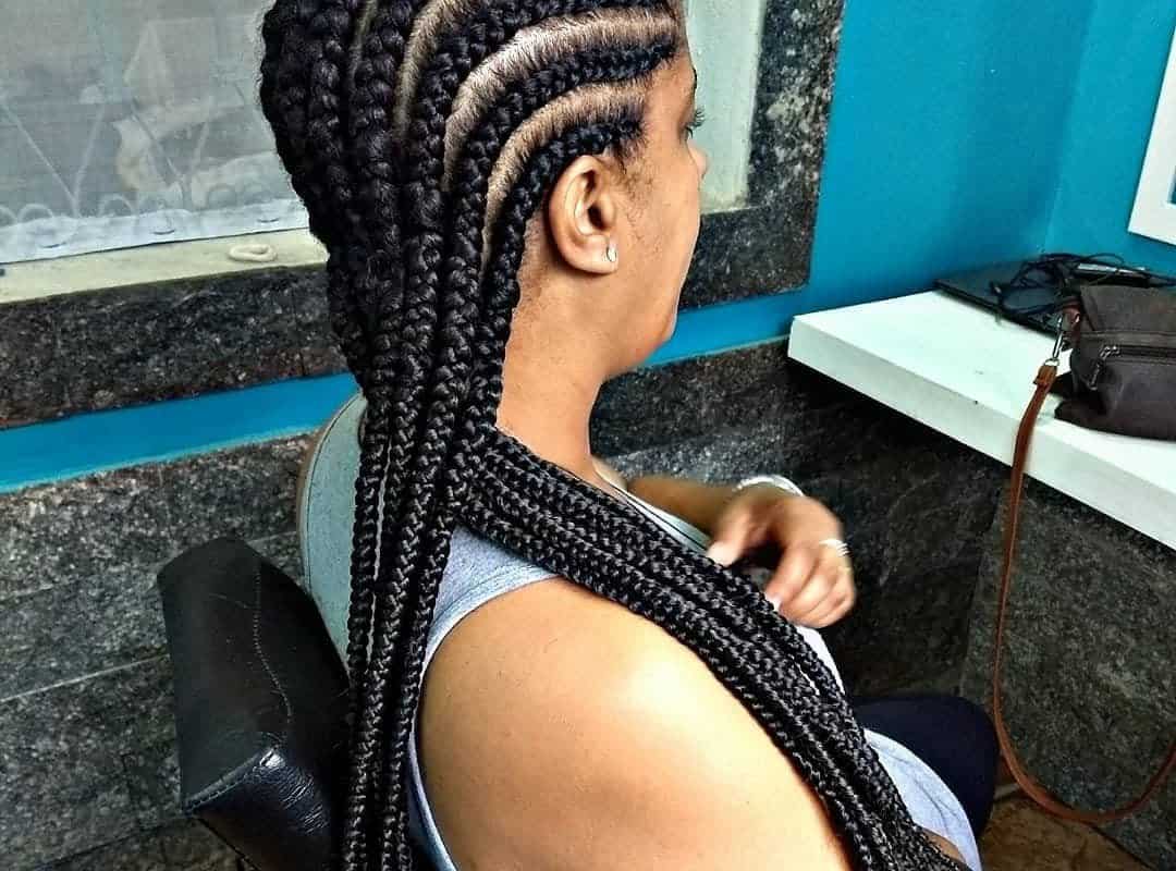 girl with black thai braids on the shoulder