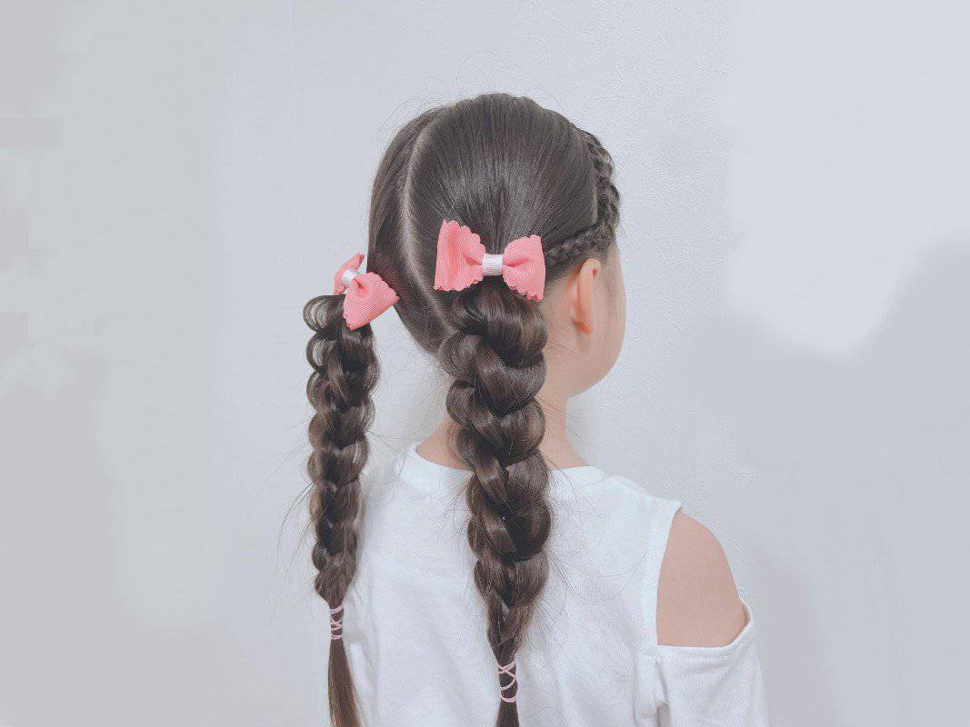 girl with brown French sleek braided ponytail