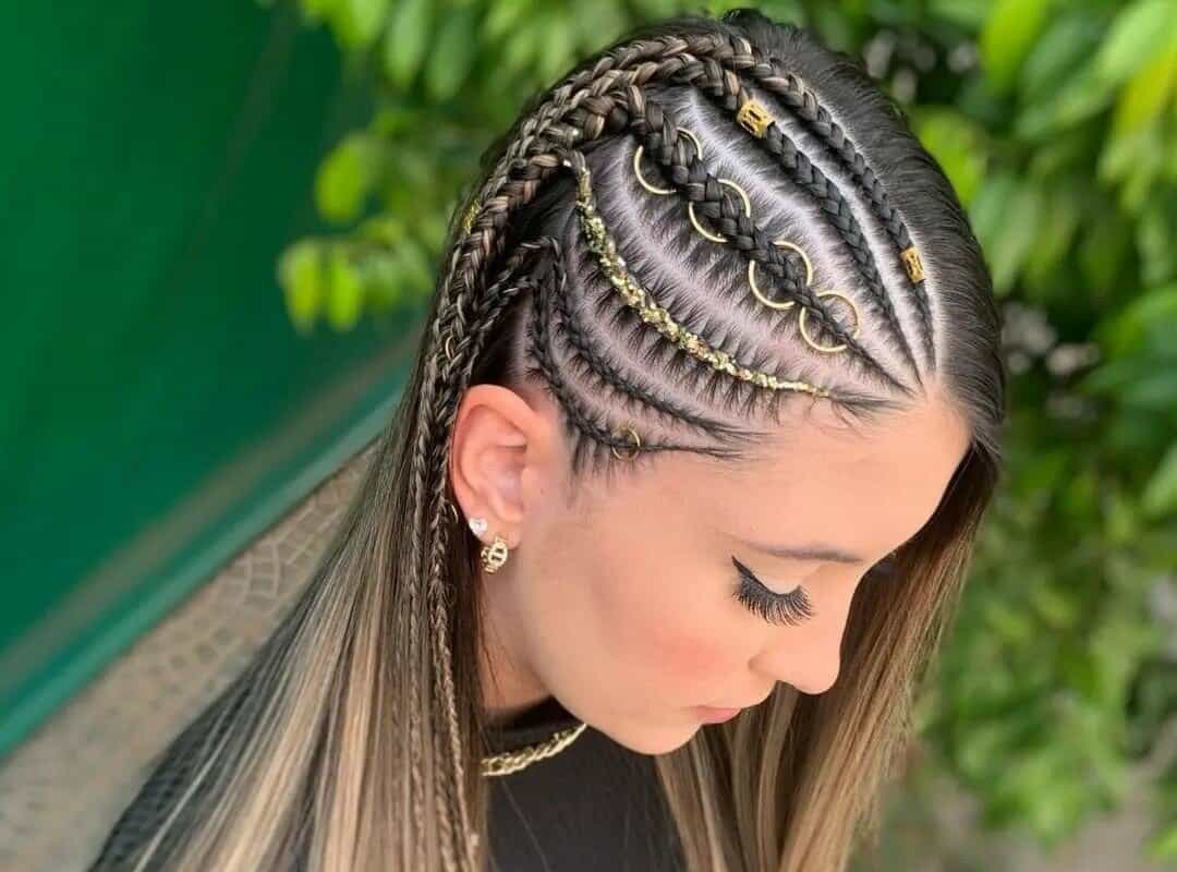 girl with brown and blonde stitch braids with decorations