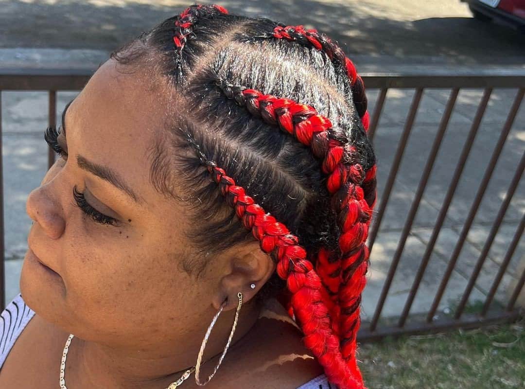 woman with brown and red stitch braids