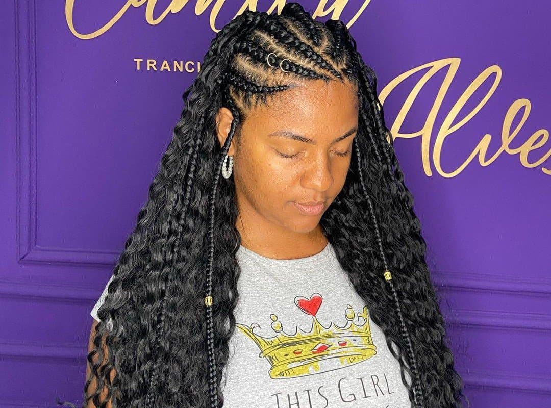 woman with dark black tribal braids with beads and curls