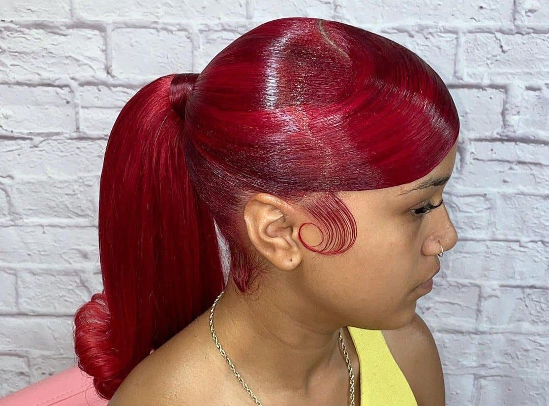 girl with red sleek high ponytail