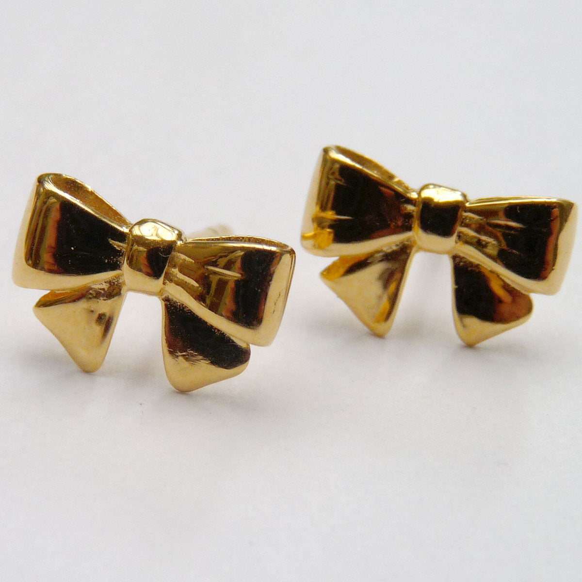 gold bow earrings studs