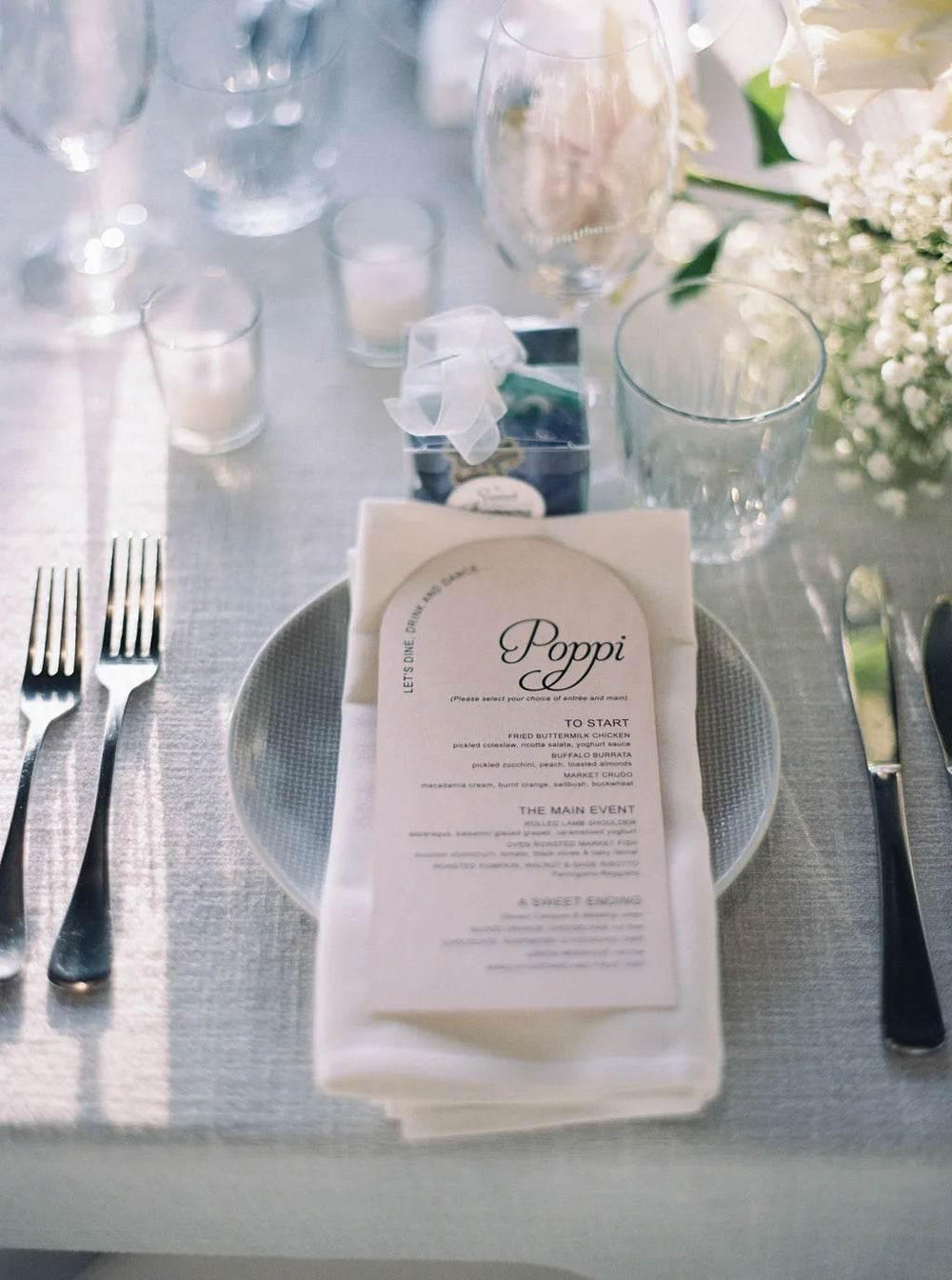 Arched menu with printed guest name.webp