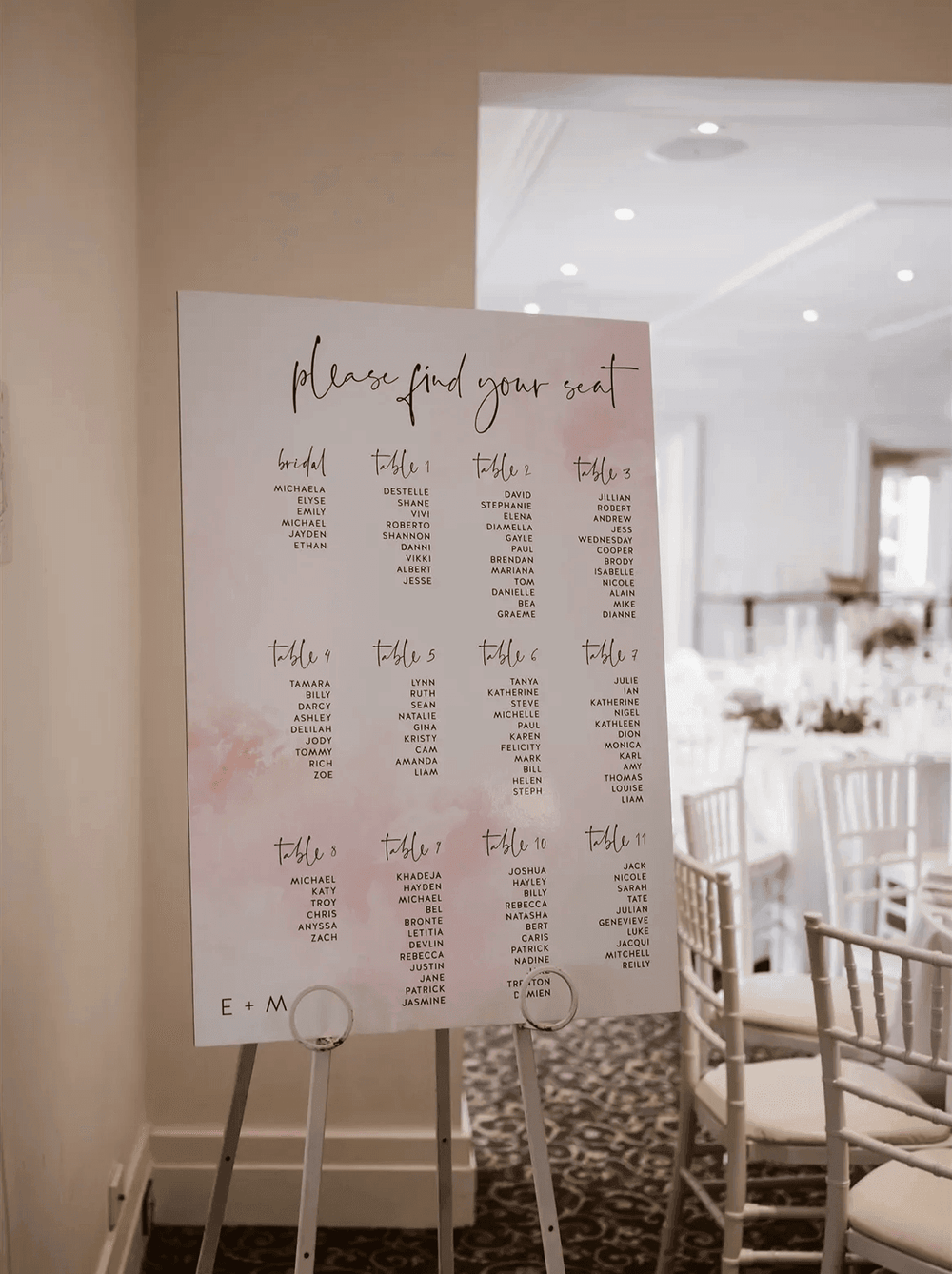 Emily & Michael  seating chart on easel.webp