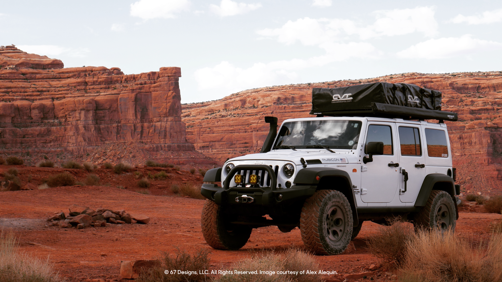 White Jeep by the red rocks