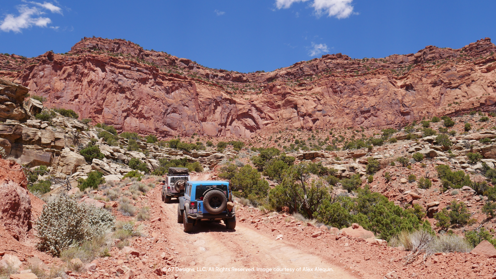 Jeep heading off into the red rocks