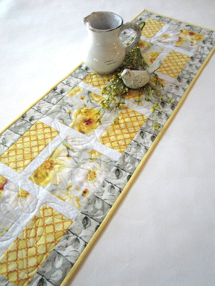 grey and yellow table runner