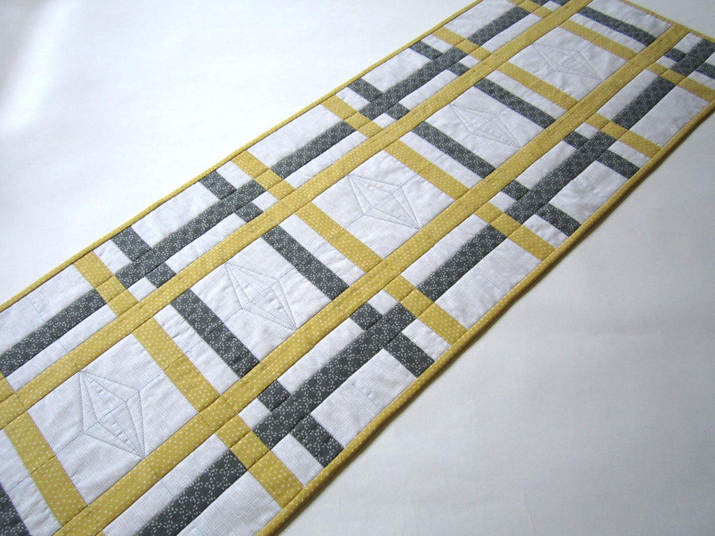 grey and yellow table runner