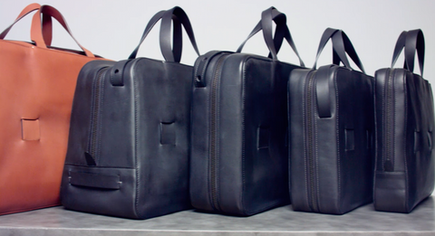 luxury leather travel bags 