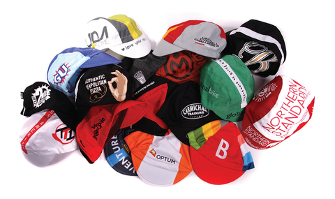 Large pile of various custom-made cycling caps.