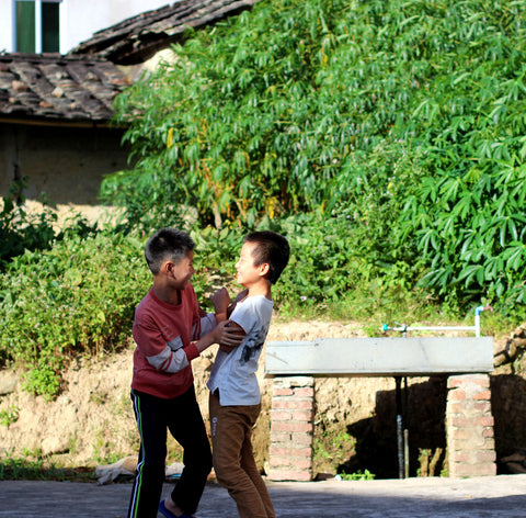 Kids playing while the tea withered