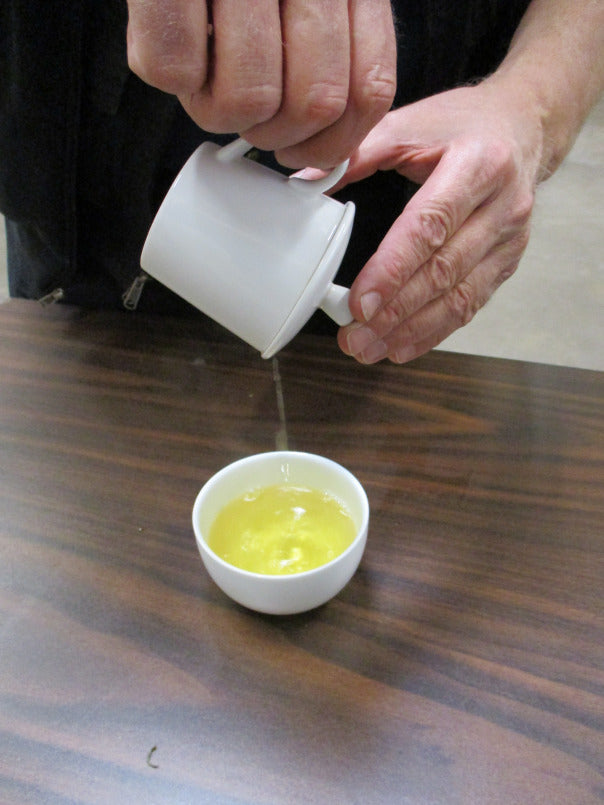 Cupping up the tea in our standard cupping set for 5 minutes with boiling water. It’s sweet, herbaceous, and has great mouth feel. 