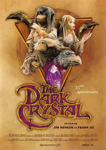 A dvd cover for the 35th anniversary release of the movie The Dark Crystal. It shows several fantasy puppets appearing on a brown background above the title of the film. 