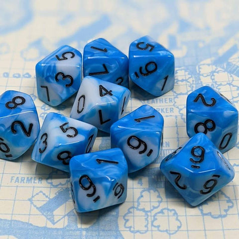 An image of the Polar Depth 10d10 Dice Set from D20Collective. The dice are all10-sided, with blue and white swirls and black lettering, atop a white and blue background
