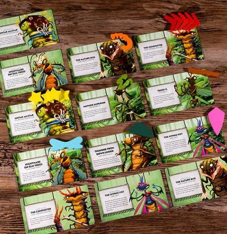 A photo of the bug wrestler characters from the Kabuto Sumo expansion Insect All-Stars laid out with their special tokens on a wooden table