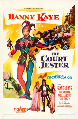 The movie poster for The Court Jester, showing a man in a colorful jesters outfit, witha  couple of beautiful women in medieval dress beside him