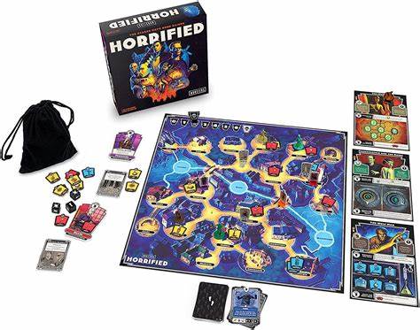The components for the game Horrified. It shows the board, which looks like a town, several monster cards, character cards, item tokens, and a small black bag