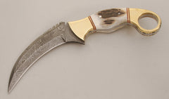 A photo of a karambit, a strongly curved blade which looks like a claw