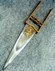 A photo of a katar, a large push knife with a square handle to hold as though you are punching something