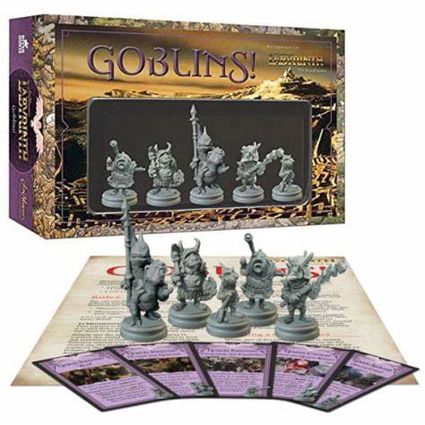 A photo of the Goblins! expansion for Labyrinth the Board Game. It shows the expansion box - a brown box with the word Labyrinth across the top, with grey goblin miniatures within. In front of the box is the miniatures, sat on top of a rules pamphlet. In front of all of these is a spread of purple cards