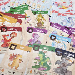 A photo of a variety of the dragon cards from Flamecraft jumbled together and spread out