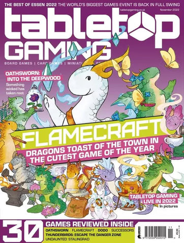 A photo of the cover of Tabletop Gaming Magazine, which features art of various colored dragons, and text banner talking about how cute and popular the game is