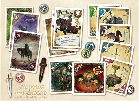 A photo of the various cards and components in the Shadows Over Camelot Card Game. There are several cards with knights on horseback, illustrations of Merlin and Morgana, and cards with swords, grails, dragons, and warriors next to those. 