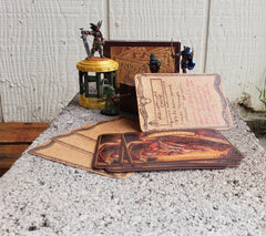 A photo of several supplemental materials of dnd. These include several miniatures, cards, a dice jail, and a dice box. 