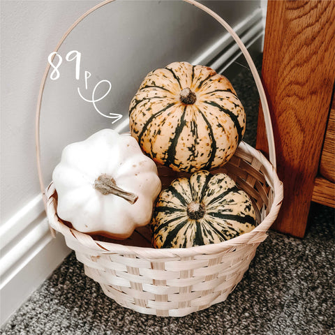 Pumpkins in a basket for autumn decor