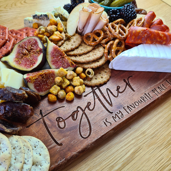 wooden charcuterie board spread idea, with the words, together is my favourite place to be engraved onto it