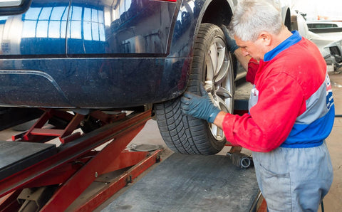 How to tell if you have a limited slip differential. Man rotating wheels.