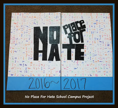 high school project students sign white puzzle pieces for bulletin board.  school fundraiser with puzzle