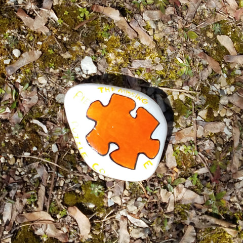 painted rock with puzzle piece