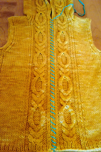 Front basted closed with contrasting yarn