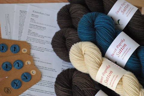 Knowlton coat knitting kit with hand-dyed yarn, hand-made buttons, and printed pattern