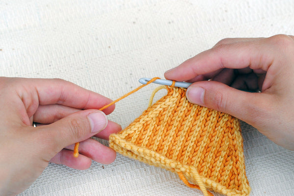 Pull yarn tail through last stitch