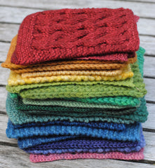 Rainbow of knit swatches stacked up