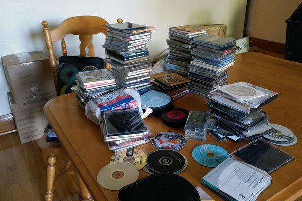 Stacks of cds and moving boxes